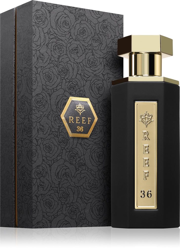 A black rectangular perfume bottle with a gold cap and a vertical gold label reading REEF 36, shown next to its matching black patterned box with a gold REEF 36 emblem.