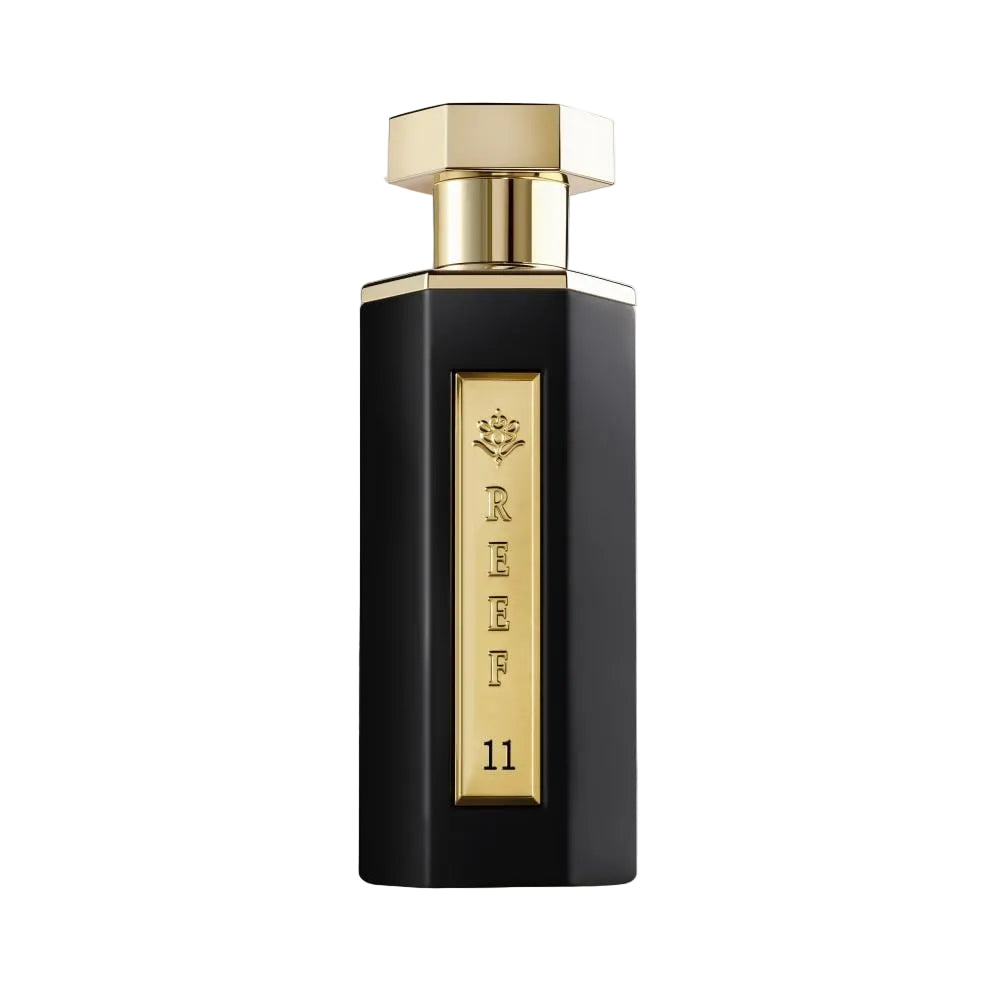Reef 11 esd 100ml. Perfume bottle with gold cap and black body on a white background
