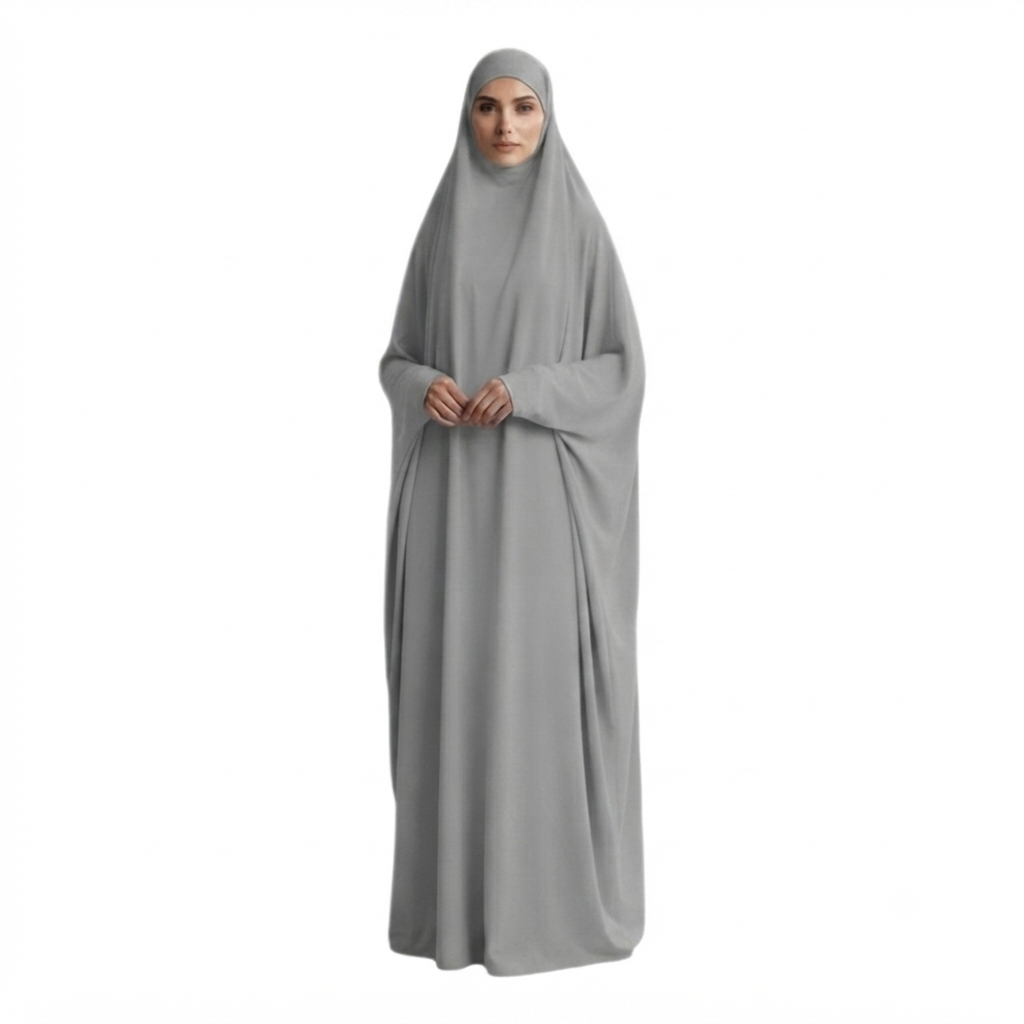 A woman wearing a full-length light gray modest garment with a matching head covering, shown against a plain white background.